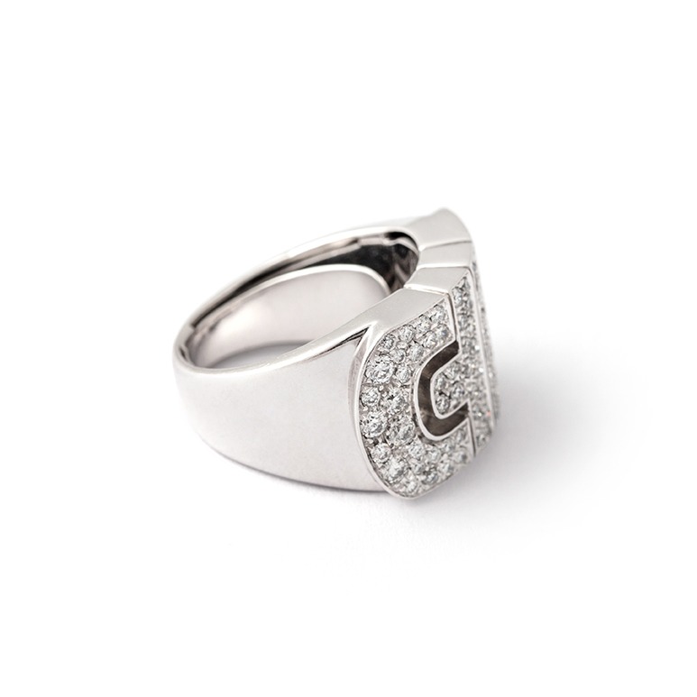 Side view of Bulgari Parentesi Revolution Ring.This ring features the iconic Parentesi motif and is made of 18k white gold. It showcases a double row of round brilliant cut diamonds set in a pave setting, adding a touch of elegance and sparkle