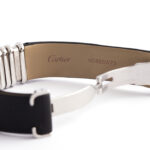 Close-up of the inside of Cartier's watch strap. It is engraved: Cartier KD85SW73