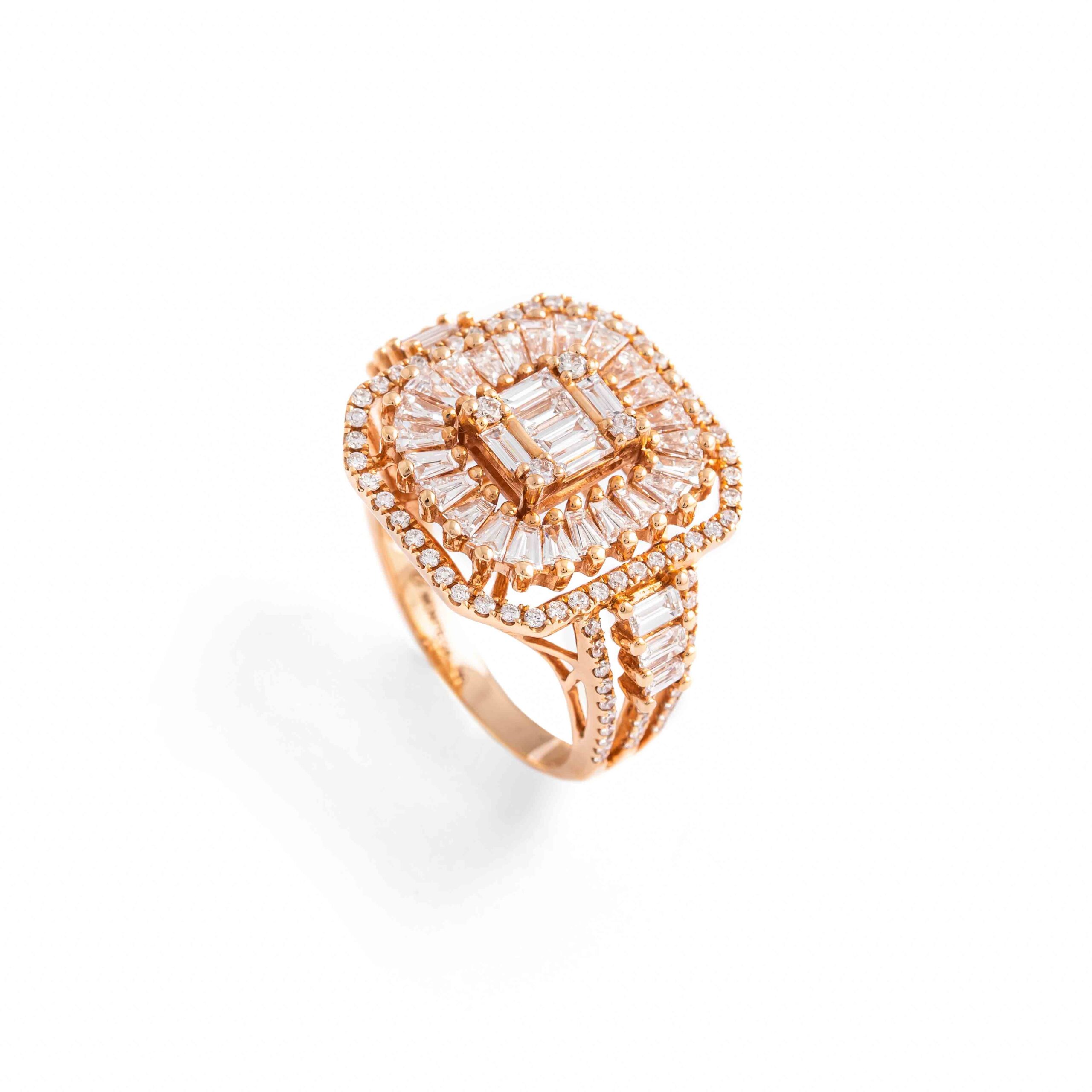 Diamond Pink Gold Ring. The center stage is adorned with 36 baguette-cut diamonds, totaling an impressive 1.47 carats.Surrounding the baguette-cut diamonds are 100 additional diamonds, totaling 0.49 carats.