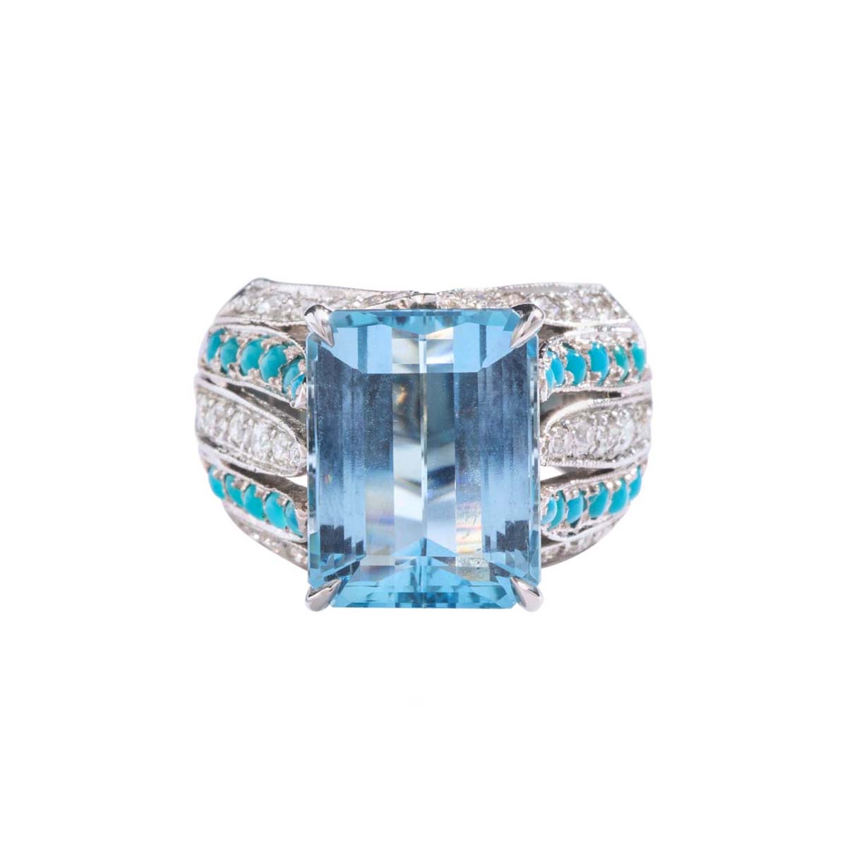 9.75 carat Aquamarine centering a diamond and cabochon turquoise platinum ring. Circa 1970.